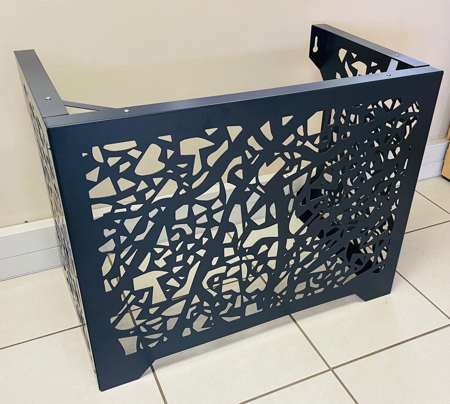 a picture of the aircon cover in the mosaic pattern and a matt charcoal color
